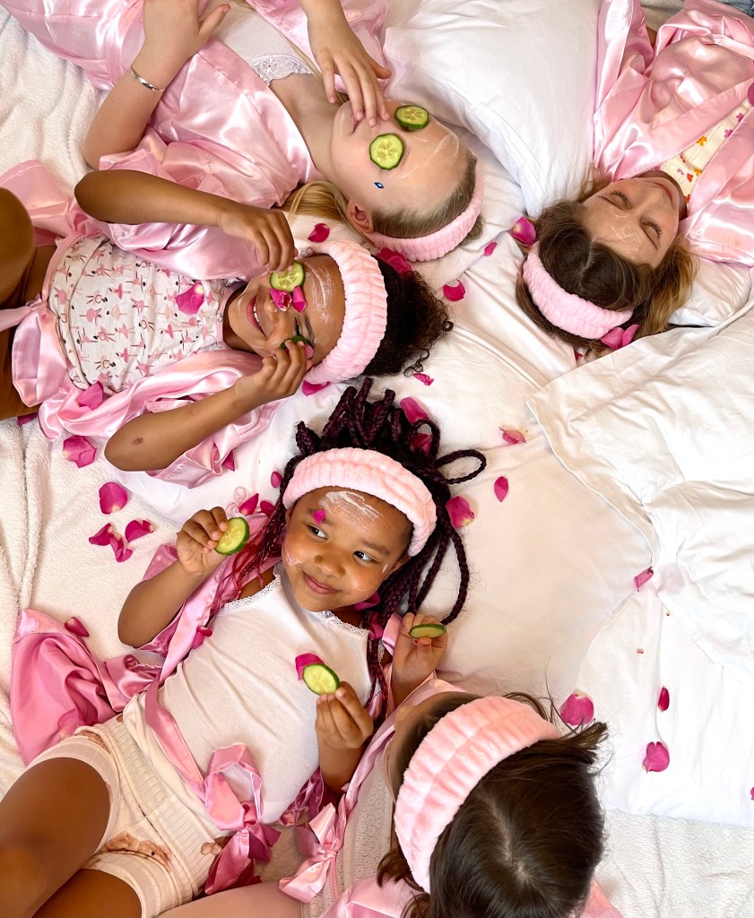 Spa, pampering party for girls. With home made face mase and cucumber on the girls eyes. Of course the girld were showered by pink roses.