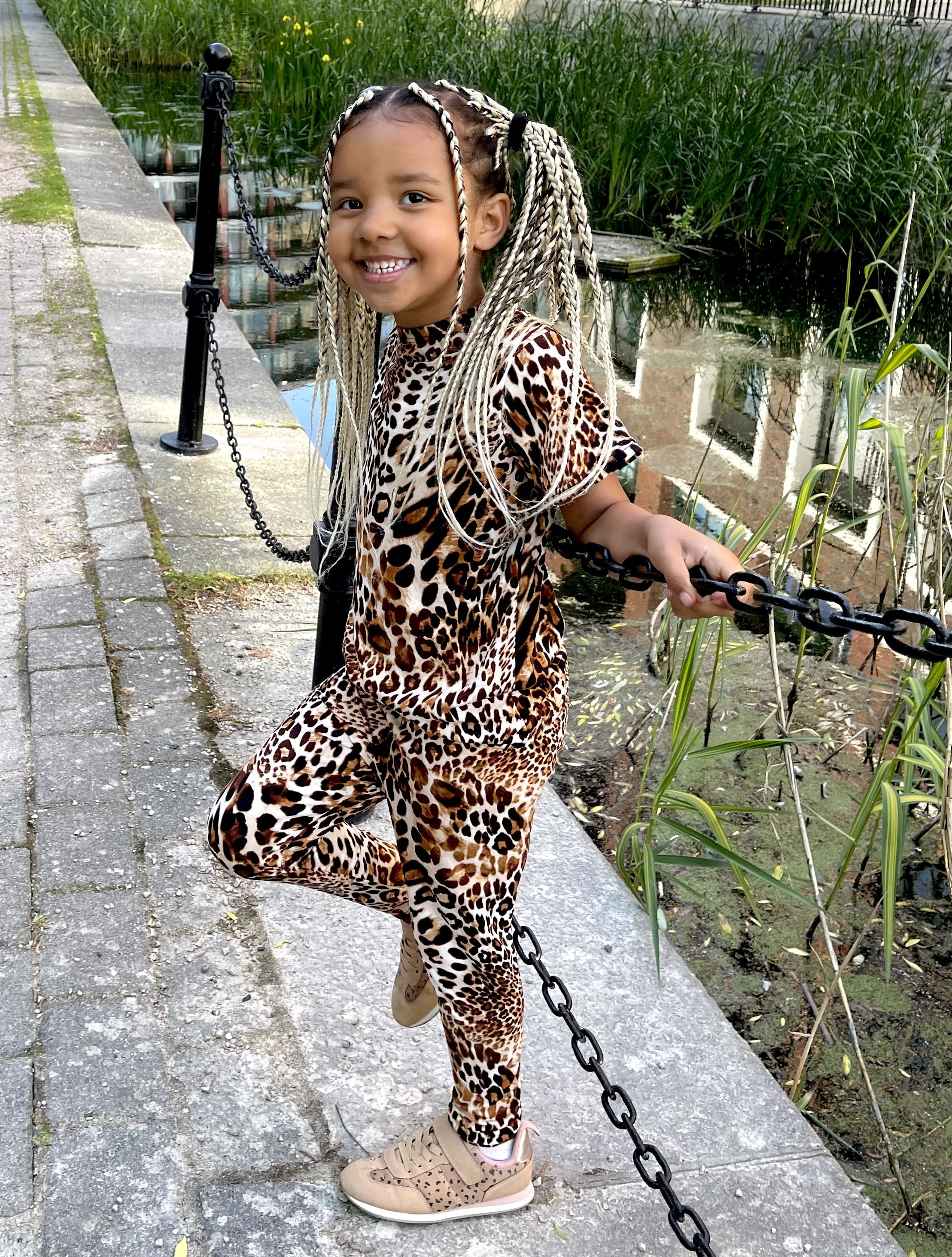 Lynnie is wearing a leopard print set from Novakids. This photo was takin at Canada Water in London, UK.